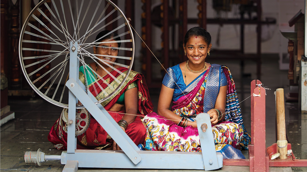Women at a spinning wheel