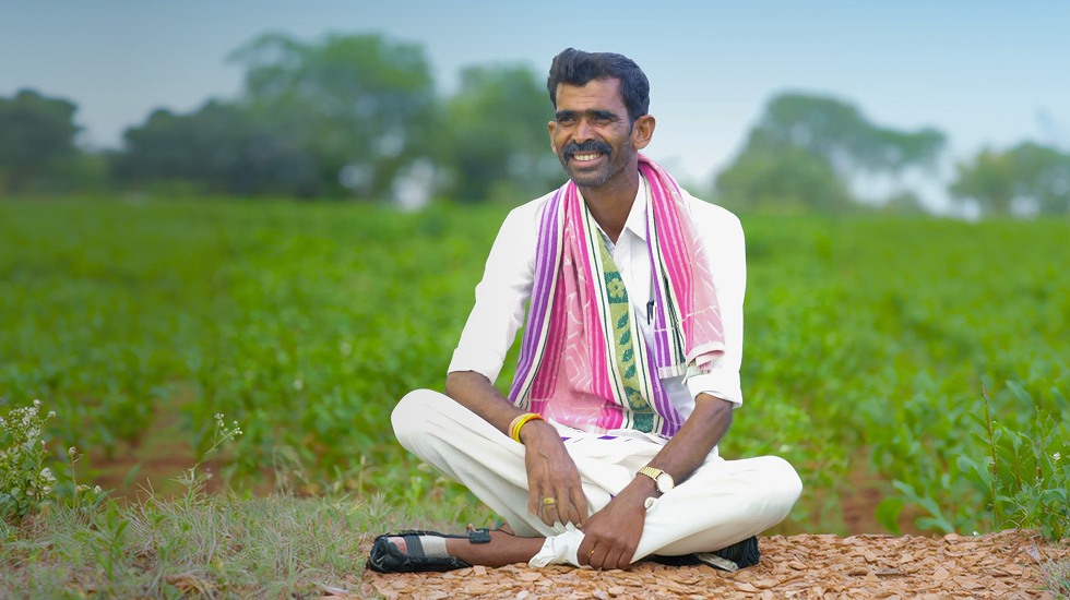 Farmer seated in a field